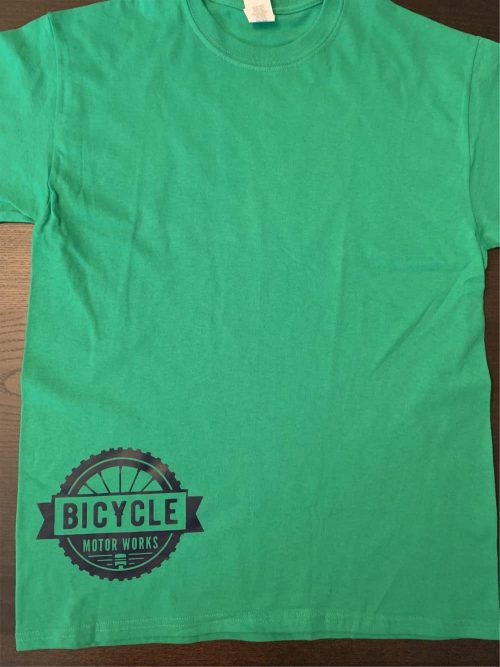 A green t-shirt with the word bicycle on it.