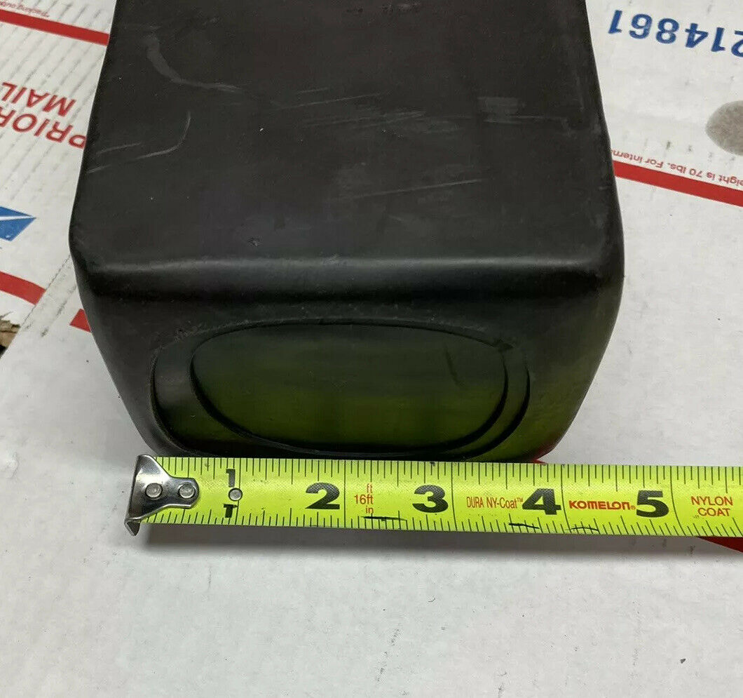A measuring tape is next to the small box.
