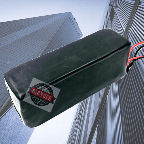 A black box hanging from the side of a building.