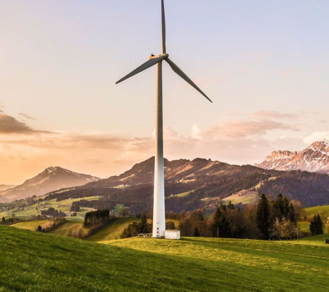 Wind turbine in a green valley.